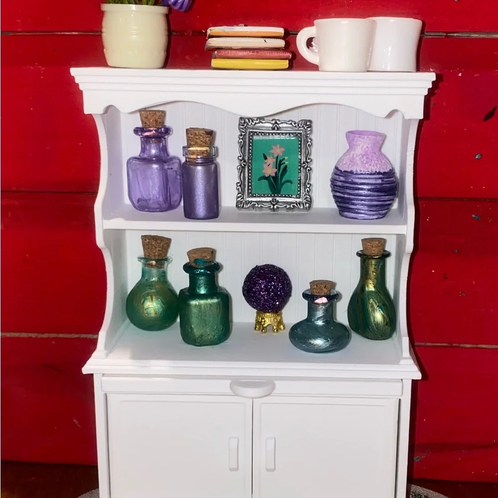 White Miniature Wall Shelf with Colorful Bottles